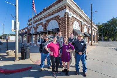 Haven City Members Standing In Front of Haven City Hall